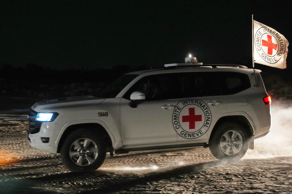 Red Cross convoy carrying the body of a person believed to be a deceased hostage handed over by Palestinians militants makes its way toward the border crossing with Israel, to be transferred to Israeli authorities, in Deir al-Balah, central Gaza Strip, Friday, Nov. 7, 2025. (AP Photo/Abdel Kareem Hana)