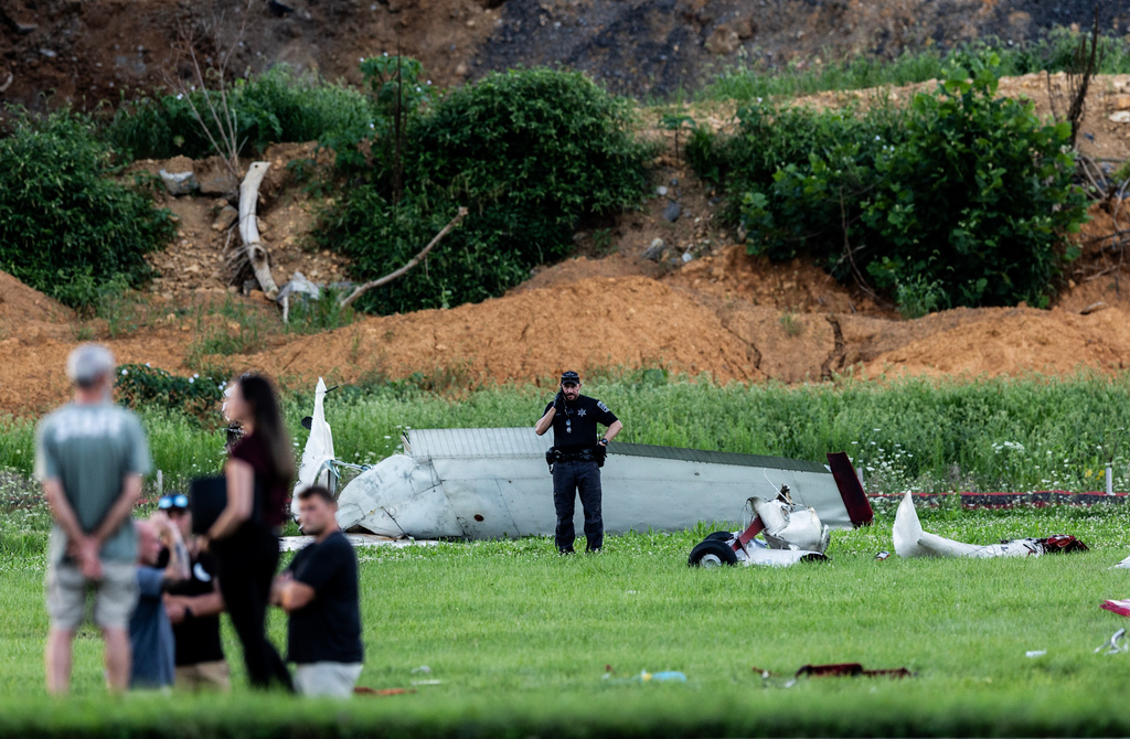 Authorities investigate a crash between a Pennsylvania State Police helicopter and a small plane at the Carlisle airport in Carlisle, Pa. Wednesday, Aug. 19, 2026. (Sean Simmers/The Patriot-News via AP)