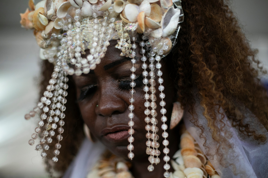 FILE - A devotee dances during a ceremony honoring Yemanja, the sea goddess of the Yoruba religion, on Copacabana Beach in Rio de Janeiro, Dec. 29, 2025. (AP Photo/Bruna Prado, File)