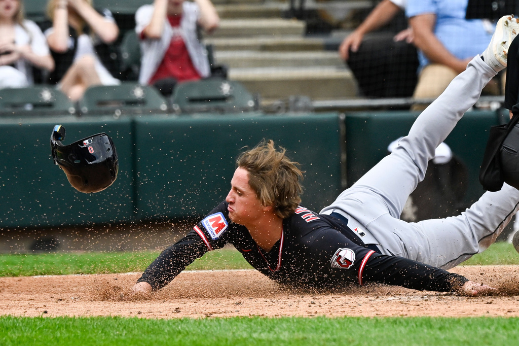 Cleveland Guardians' Petey Halpin scores during the sixth inning of a baseball game against the Chicago White Sox, Wednesday, June 24, 2026, in Chicago. (AP Photo/Matt Marton)