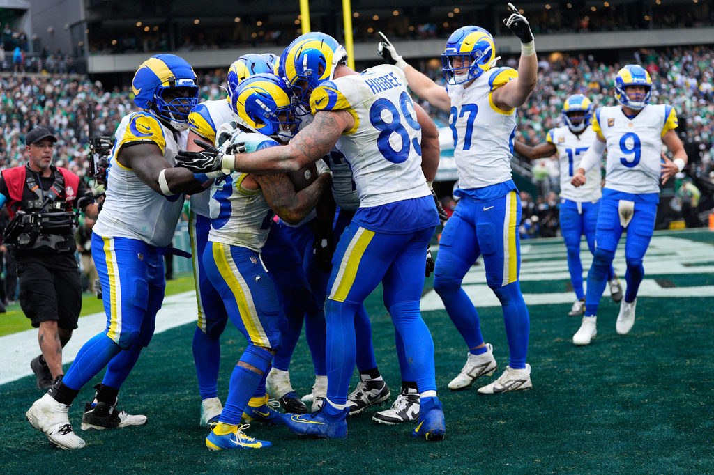 Los Angeles Rams running back Kyren Williams (23) celebrates his touchdown with teammates during the second half of an NFL football game against the Philadelphia Eagles in Philadelphia, Sunday, Oct. 4, 2026. (AP Photo/Chris Szagola)
