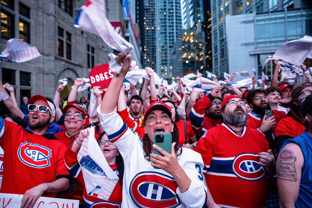 Fans cheer on the Montreal Canadiens during first period NHL playoff hockey game between the Montreal Canadiens and the Carolina Hurricanes in Montreal on Wednesday, May 27, 2026. (Christopher Katsarov/The Canadian Press via AP)
