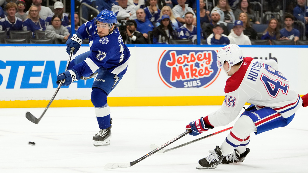 Tampa Bay Lightning center Dominic James (17) shoots for a goal after getting past Montréal Canadiens defenseman Lane Hutson (48) during the second period in Game 5 of an NHL hockey Stanley Cup first-round playoff series, Wednesday, April 29, 2026, in Tampa, Fla. (AP Photo/Chris O'Meara)