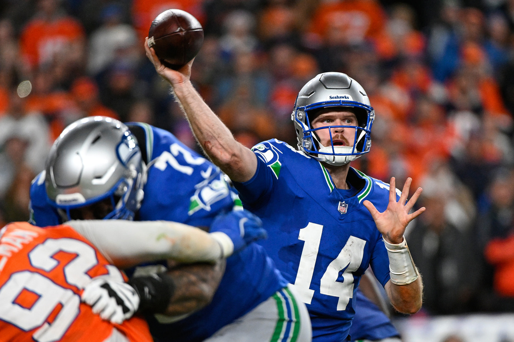 Seattle Seahawks quarterback Sam Darnold throws against the Denver Broncos during overtime in an NFL football game in Denver, Thursday, Oct. 15, 2026. (AP Photo/Geneva Heffernan)