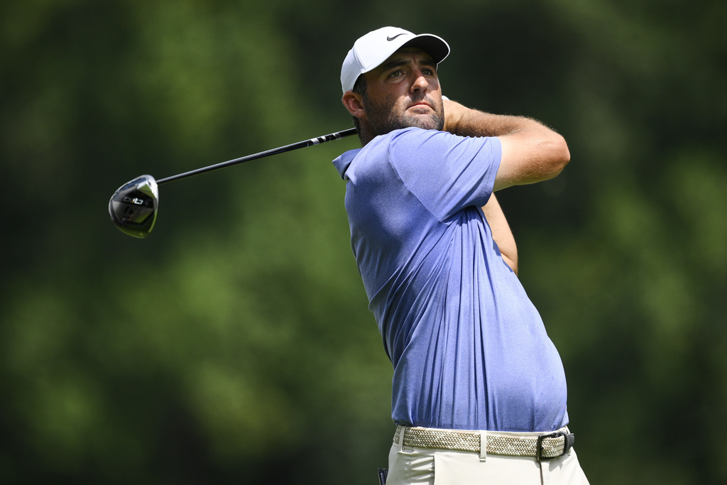 Scottie Scheffler hits from the seventh tee during the first round of the BMW Championship golf tournament Thursday, Aug. 14, 2025, in Owings Mills, Md. (AP Photo/Nick Wass)