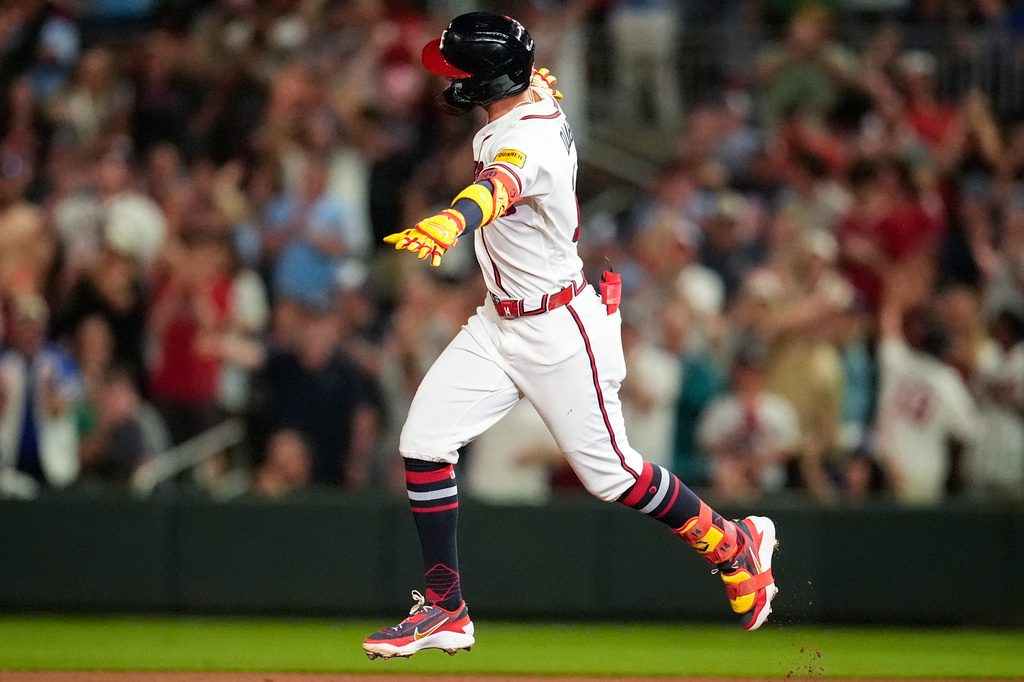 Atlanta Braves' Mauricio Dubón celebrates his two-run home run against the Chicago Cubs in the eighth inning of a baseball game, Wednesday, May 13, 2026, in Atlanta. (AP Photo/Mike Stewart)