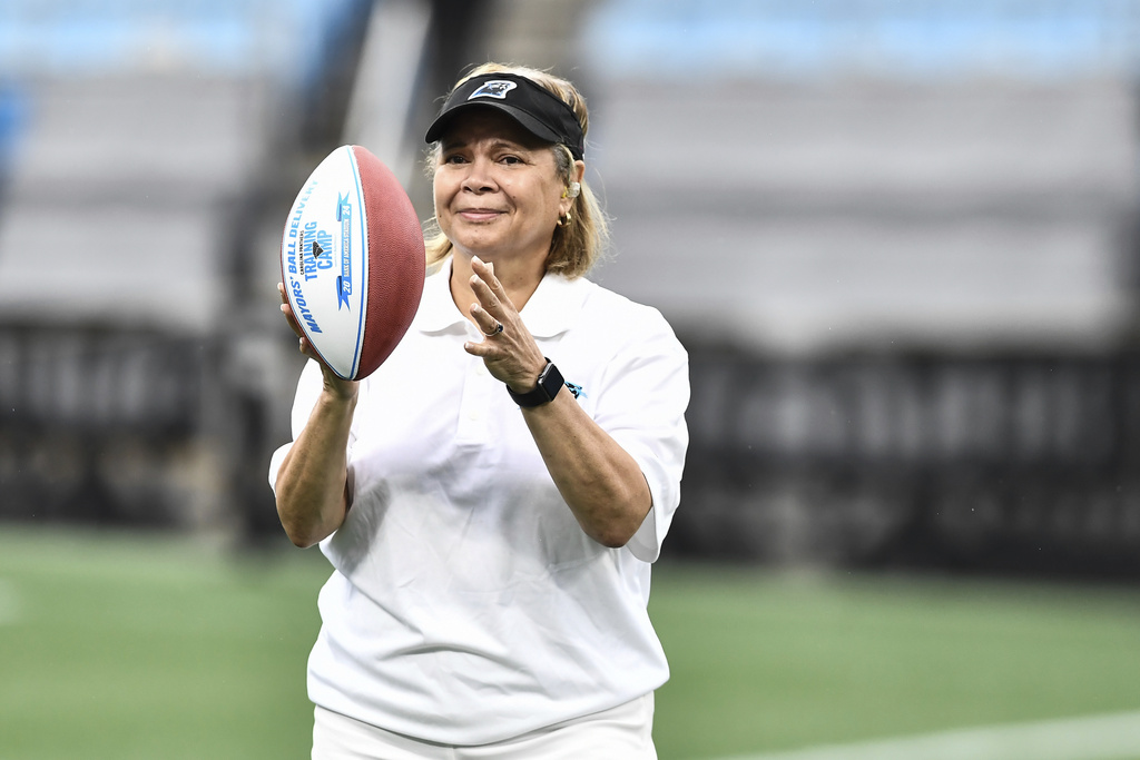 FILE - Charlotte Mayor Vi Lyles catches a Carolina Panthers football during the NFL football team's training camp in Charlotte, N.C., July 27, 2024. (AP Photo/Matt Kelley, File)