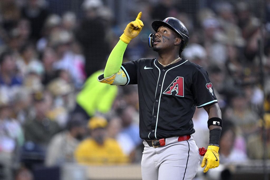 Arizona Diamondbacks' Geraldo Perdomo celebrates while rounding the bases after hitting a grand slam home run during the fifth inning of a baseball game against the San Diego Padres, Wednesday, July 9, 2025, in San Diego. (AP Photo/Orlando Ramirez)