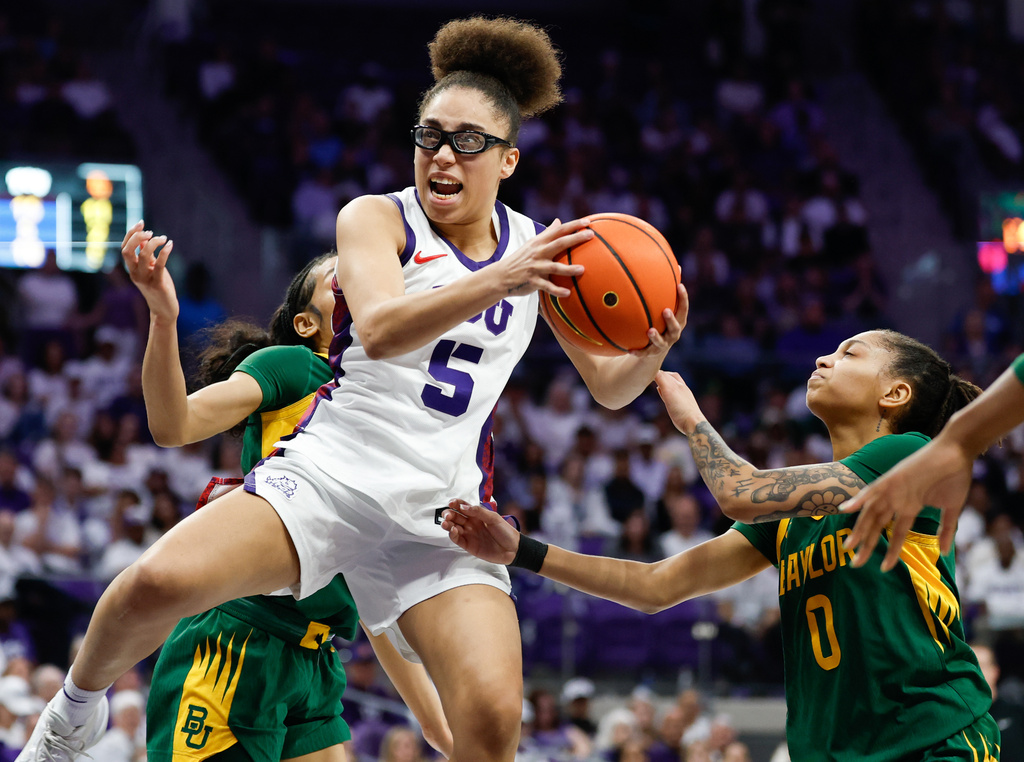 TCU guard Olivia Miles looks to score ahead of Baylor guard Taliah Scott during the first half of an NCAA college basketball game, Sunday, March 1, 2026, in Fort Worth, Texas. (Chris Jones/Waco Tribune-Herald, via AP)
