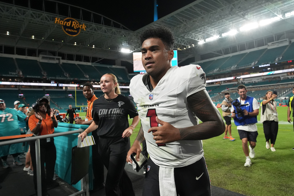 Atlanta Falcons quarterback Tua Tagovailoa (1) jogs off the field after an NFL preseason football game against the Miami Dolphins, Friday, Aug. 28, 2026, in Miami Gardens, Fla. (AP Photo/Lynne Sladky)