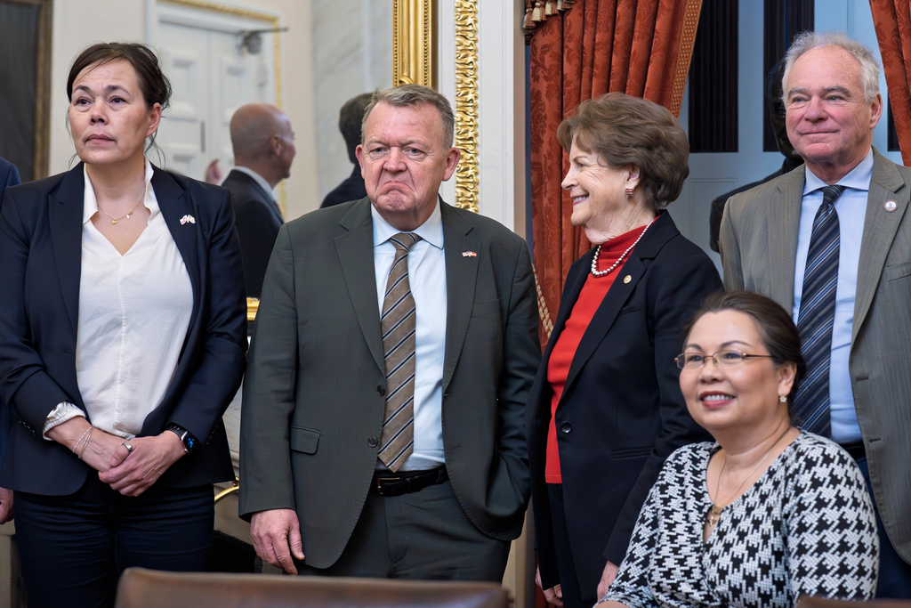 From left, Greenland Foreign Minister Vivian Motzfeldt, Danish and Foreign Minister Lars Løkke Rasmussen, stand with members of the Senate Foreign Relations Committee, Sen. Jeanne Shaheen, D-N.H., Sen. Tammy Duckworth, D-Ill., and Sen. Tim Kaine, D-Va., amid President Donald Trump's ambitions to take control of Greenland, a semiautonomous territory of Denmark, during a meeting at the Capitol in Washington, Thursday, Jan. 15, 2026. (AP Photo/J. Scott Applewhite)