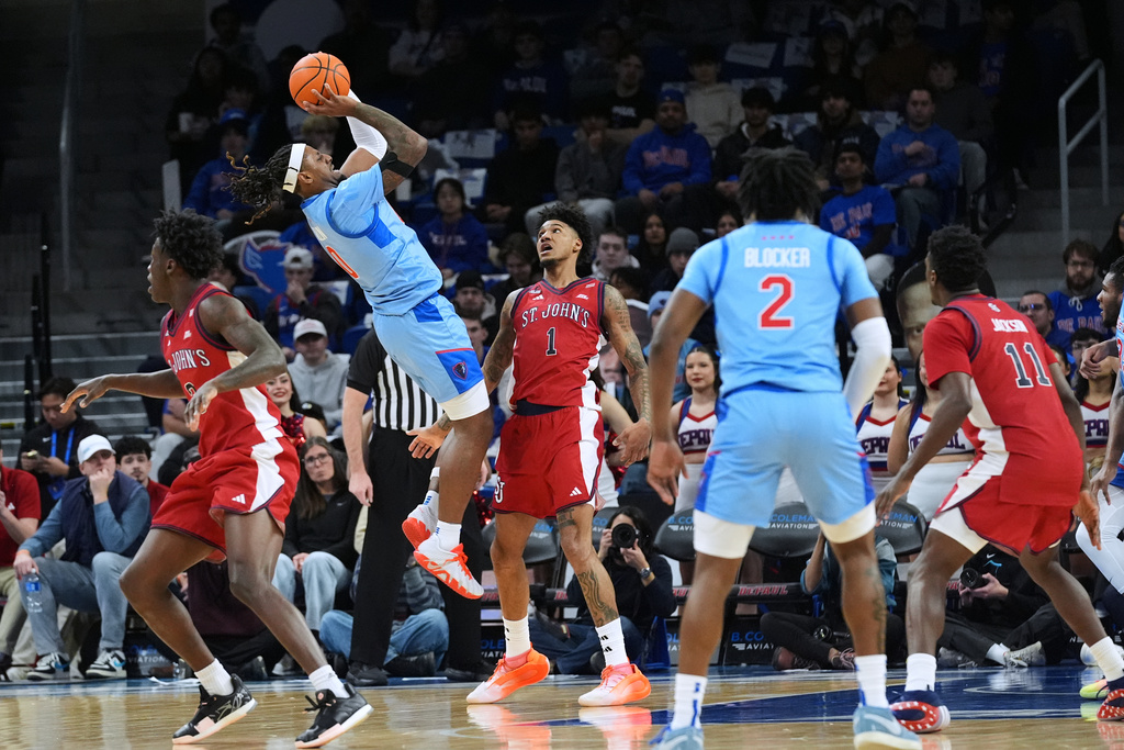 DePaul guard Brandon MacLin (0) shoots against St. John's forward Dillon Mitchell (1) during the first half of an NCAA college basketball game in Chicago, Tuesday, Feb. 3, 2026. (AP Photo/Nam Y. Huh)
