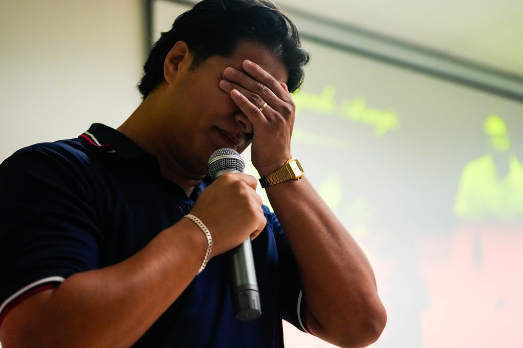 Ronaldo Salgado, the son of Lorenzo Salgado Araujo, speaks during a community vigil honoring his father in Houston on Saturday, July 11, 2026. (Raquel Natalicchio/Houston Chronicle via AP)