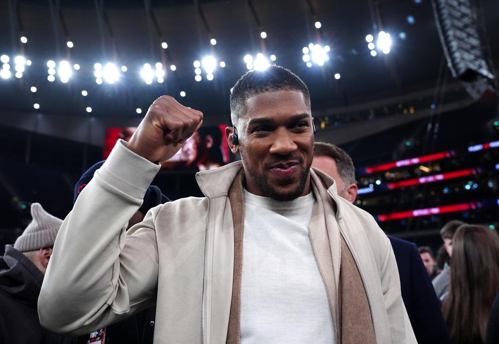 Boxer Anthony Joshua reacts following the heavyweight bout between Tyson Fury and Arslanbek Makhmudov in London, Saturday, April 11, 2026. (Bradley Collyer/PA via AP)
