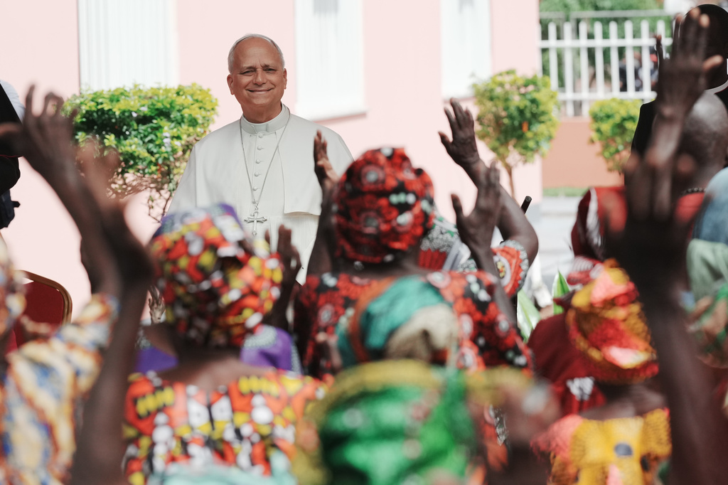 Pope Leo XIV is cheered by faithful on the occasion of his visit to a nursing home, in Saurimo, Angola, Monday, April 20, 2026. (AP Photo/Andrew Medichini)