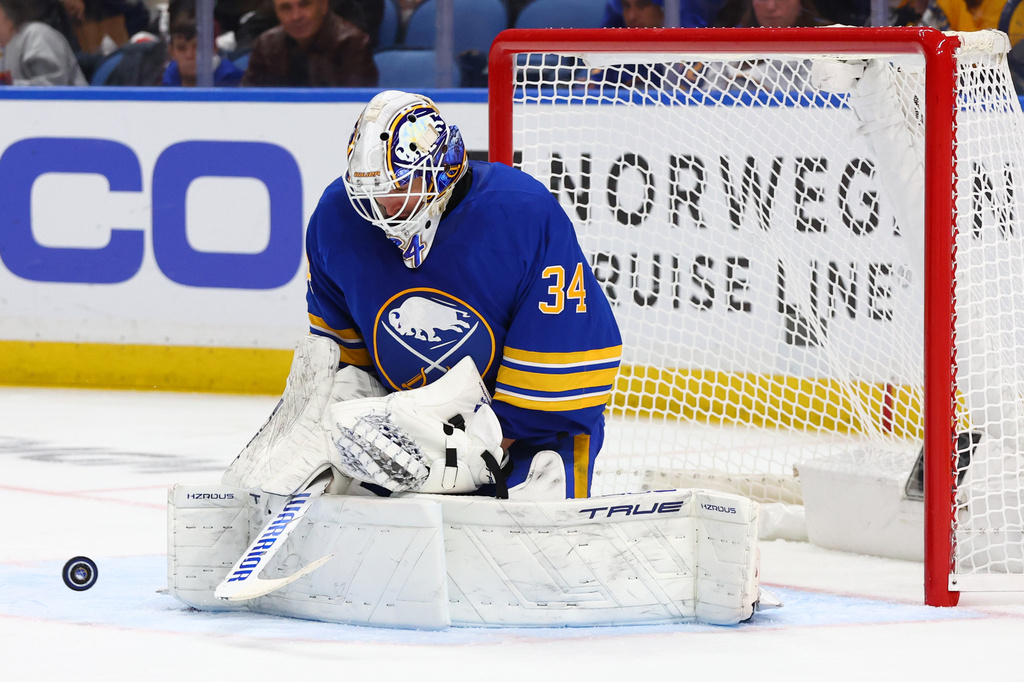 Buffalo Sabres goaltender Alex Lyon (34) makes a save during the second period in Game 5 of a first-round NHL hockey Stanley Cup playoff series against the Boston Bruins Tuesday, April 28, 2026, in Buffalo, N.Y. (AP Photo/Jeffrey T. Barnes)