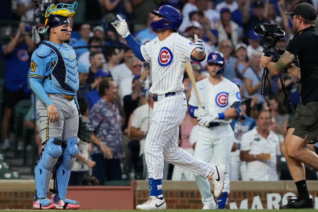 Chicago Cubs' Tyrone Taylor, center, celebrates after hitting a two-run home run during the first inning of a baseball game against the Milwaukee Brewers in Chicago, Monday, Aug. 31, 2026. (AP Photo/Nam Y. Huh)