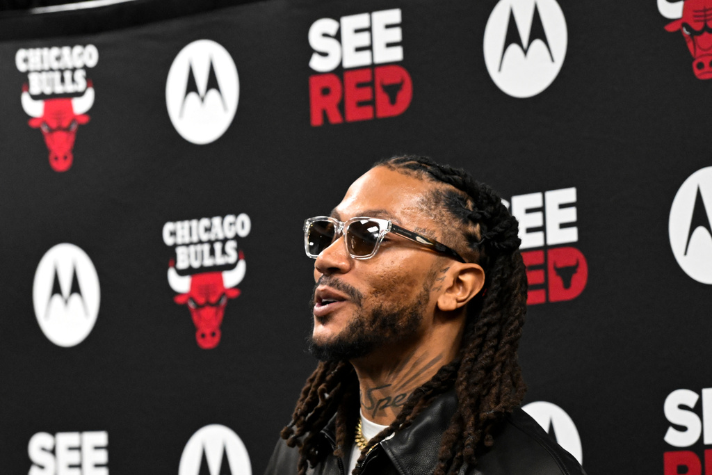 Former Chicago Bulls player Derrick Rose, smiles after a press conference before an NBA basketball game against the Boston Celtics, Saturday, Jan. 24, 2026, in Chicago. (AP Photo/Matt Marton)