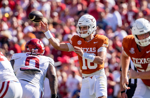 Texas quarterback Arch Manning, center, throws a pass during the first half of an NCAA college football game against Oklahoma, Saturday, Oct. 11, 2025, in Dallas. (AP Photo/Jeffrey McWhorter) Texas quarterback Arch Manning, center, throws a pass during the first half of an NCAA college football game against Oklahoma, Saturday, Oct. 11, 2025, in Dallas. (AP Photo/Jeffrey McWhorter)
