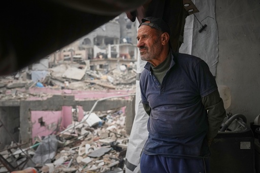 Khaled Nassar looks over the destruction at his apartment in the Jabaliya refugee camp in Gaza City Feb. 9, 2025. Nassar's daughter, Dalia, and his son, Mahmoud, were killed in separate airstrikes, leaving both buried under their homes. (AP Photo/Abdel Kareem Hana) Khaled Nassar looks over the destruction at his apartment in the Jabaliya refugee camp in Gaza City Feb. 9, 2025. Nassar's daughter, Dalia, and his son, Mahmoud, were killed in separate airstrikes, leaving both buried under their homes. (AP Photo/Abdel Kareem Hana)