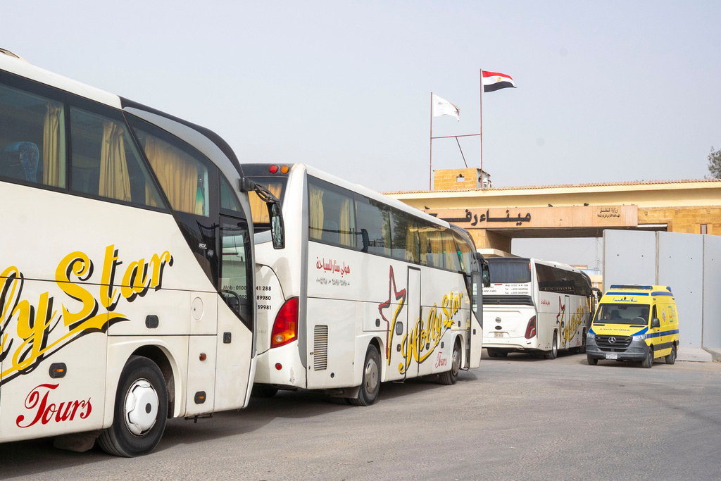 Buses line up to enter the Egyptian gate of the Rafah crossing into the Gaza Strip, in Rafah, Egypt, Monday, Feb. 2, 2026. (AP Photo/Mohamed Arafat)