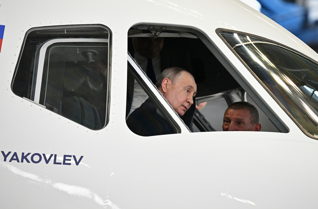 Russian President Vladimir Putin in the cockpit of the new Yakovlev MC-21-300 medium-haul passenger aircraft during a visit to the Gromov Flight Research Institute in Zhukovsky, outside Moscow, Wednesday, June 24, 2026. (Yuri Kochetkov, Sputnik, Kremlin Pool Photo via AP)