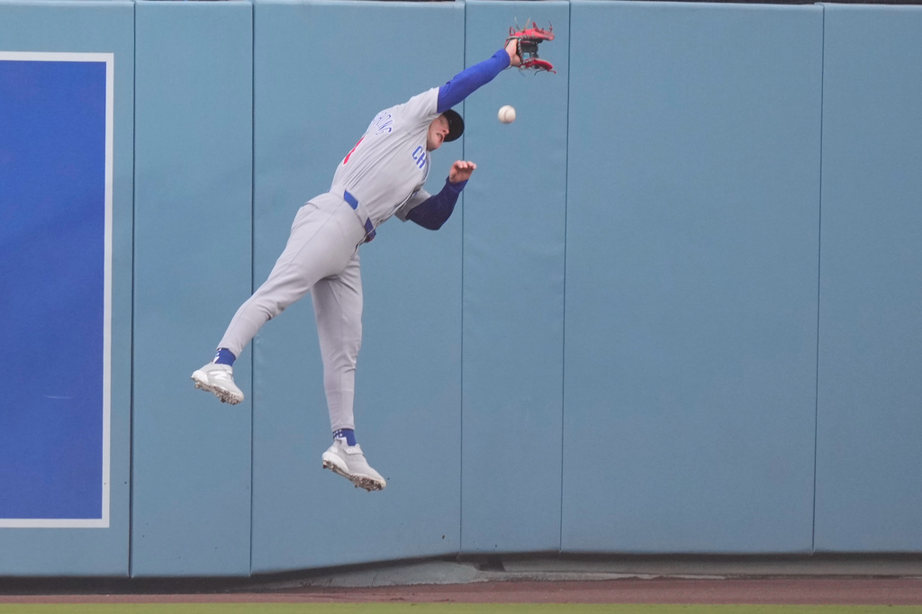 Chicago Cubs center fielder Pete Crow-Armstrong can't get to a ball hit for a double by Los Angeles Dodgers' Alex Freeland during the fifth inning of a baseball game Saturday, April 25, 2026, in Los Angeles. (AP Photo/Mark J. Terrill)