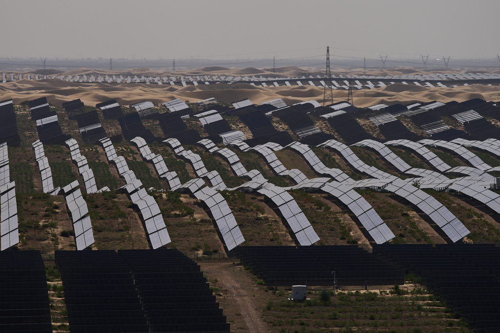 Solar panels operate at the Dalad Banner Photovoltaic Top Runner Base in northern China's Inner Mongolia province on Friday, June 12, 2026. (AP Photo/Ng Han Guan)