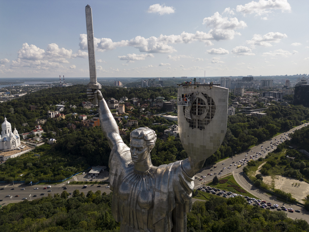 FILE - The Motherland Monument is seen after workers removed a Soviet emblem from the shield of the monument in Kyiv, Ukraine, Aug. 1, 2023. (AP Photo/Jae C. Hong, File)