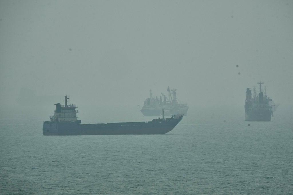 Commercial vessels anchored amid haze in the Strait of Hormuz off Bandar Abbas, Iran, Monday, Sept. 7, 2026. (AP Photo/Vahid Salemi)