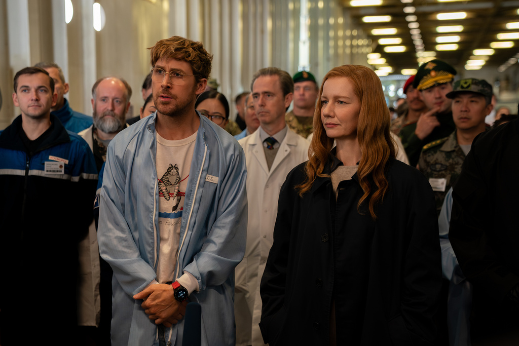 This image released by Amazon MGM Studios shows Ryan Gosling, left, and and Sandra Hüller in a scene from "Project Hail Mary." (Jonathan Olley/Amazon MGM Studios via AP)