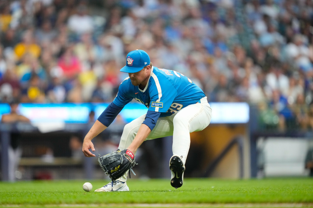 Milwaukee Brewers pitcher Chad Patrick fields a ground ball hit by Miami Marlins' Javier Sanoja during the sixth inning of a baseball game Friday, July 17, 2026, in Milwaukee. (AP Photo/Kayla Wolf)