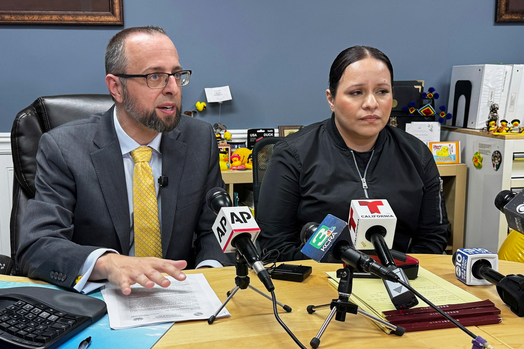 Patrick Kolasinski, attorney for Carlos Ivan Mendoza Hernandez, speaks at a news conference accompanied by his client's girlfriend, Cindy, in Modesto, Calif., Wednesday, April 8, 2026. (AP Photo/Terry Chea)