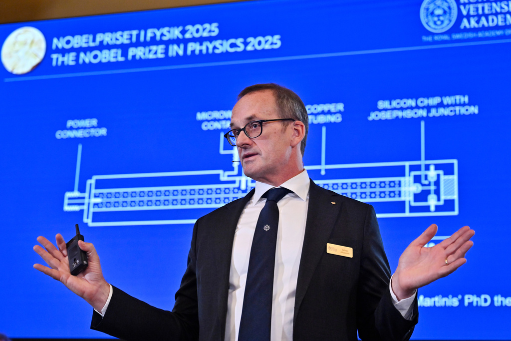 Member of the Nobel Committee for Physics Goran Johansson explains this year's Nobel Prize in Physics, awarded to John Clarke, Michel H Devoret and John M. Martinis, at the Nobel Assembly of the Karolinska Institutet, in Stockholm, Sweden, Tuesday, Oct. 7, 2025. (Christine Olsson/TT News Agency via AP)