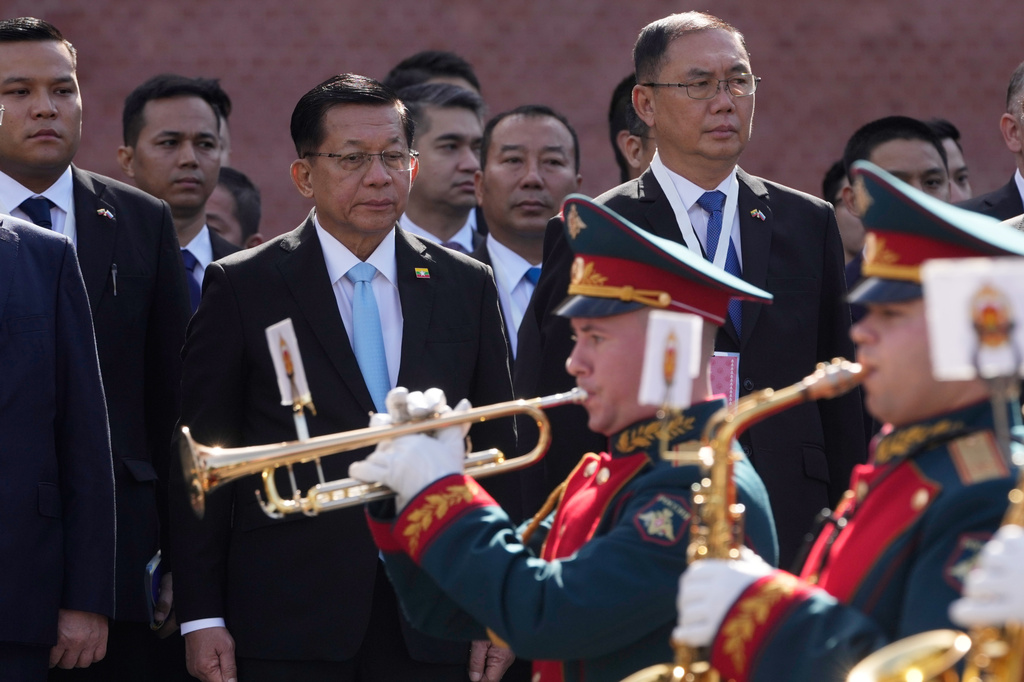 Myanmar President Min Aung Hlaing, center, attends a wreath-laying ceremony at the Tomb of the Unknown Soldier near the Kremlin wall in Moscow, Tuesday, Aug. 18, 2026. (AP Photo/Pavel Bednyakov, Pool)