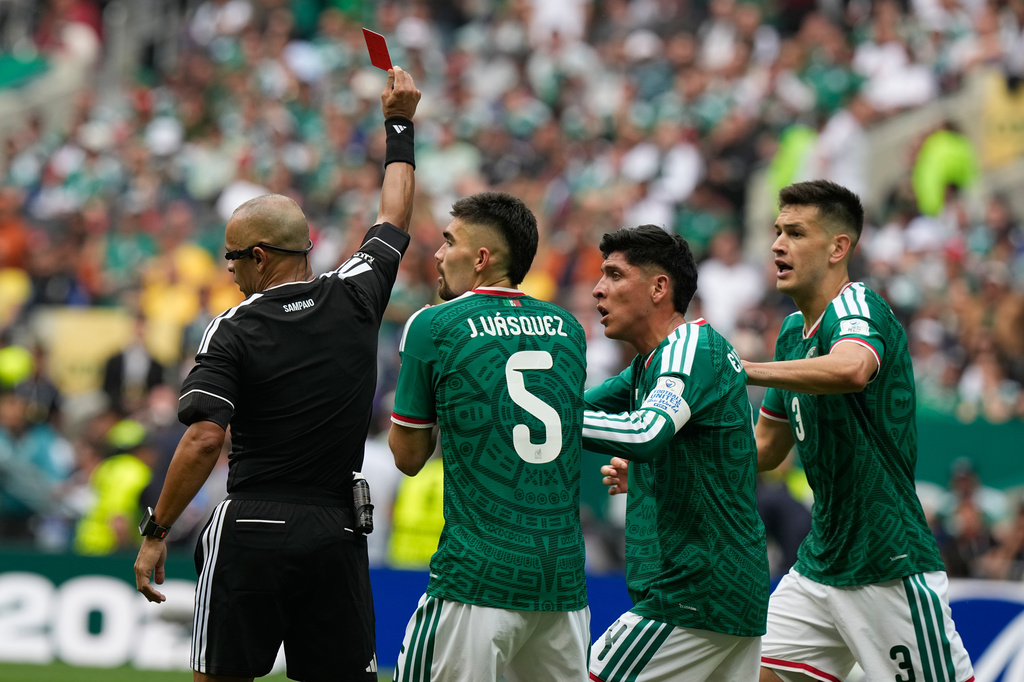 Referee Wilton Sampaio, of Brazil, sends off Mexico's Cesar Montes, right, during the World Cup Group A soccer match between Mexico and South Africa in Mexico City, Thursday, June 11, 2026. (AP Photo/Fernando Llano)