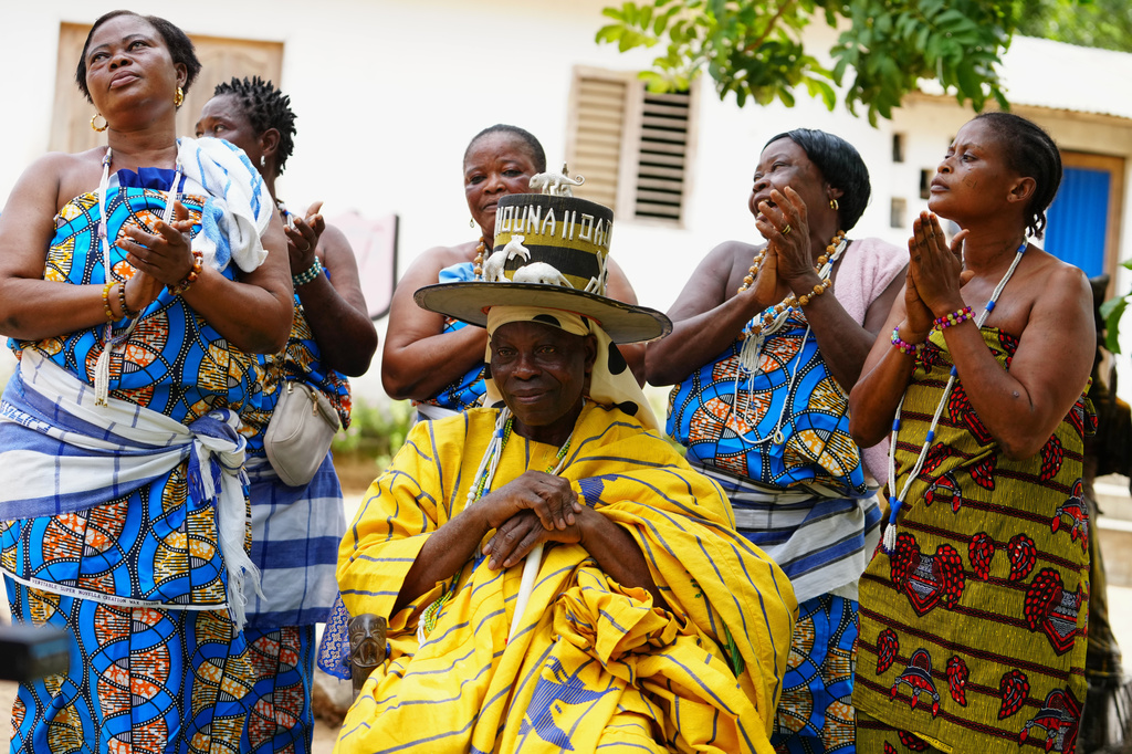 Daagbo Hounon Houna II, the Supreme Spiritual Voodoo Chief, surrounded by priestesses, is interviewed by The Associated Press, in Ouidah, Benin, May 14, 2026. (AP Photo/Sunday Alamba)