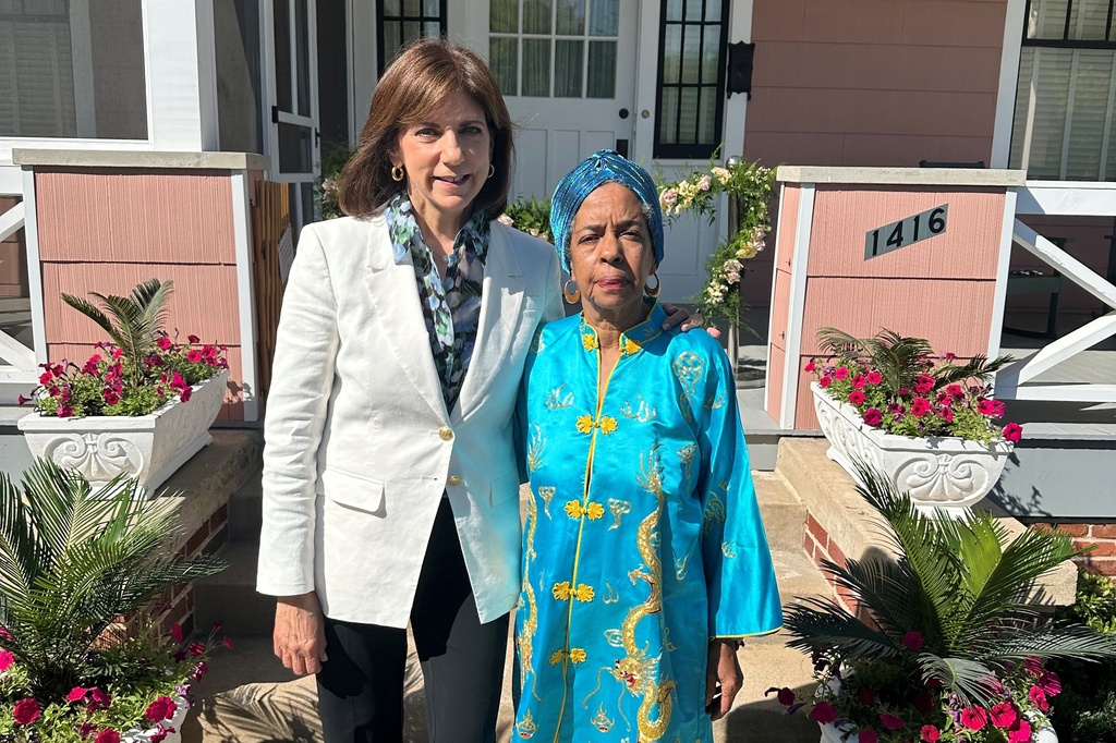 The Henry Ford Museum President and Chief Executive Patricia Mooradian, left, and Jawana Jackson pose for a photo outside Jackson's reconstructed family home Friday, June 12, 2026, on the museum grounds in Dearborn, Mich. (AP Photo/Corey Williams)