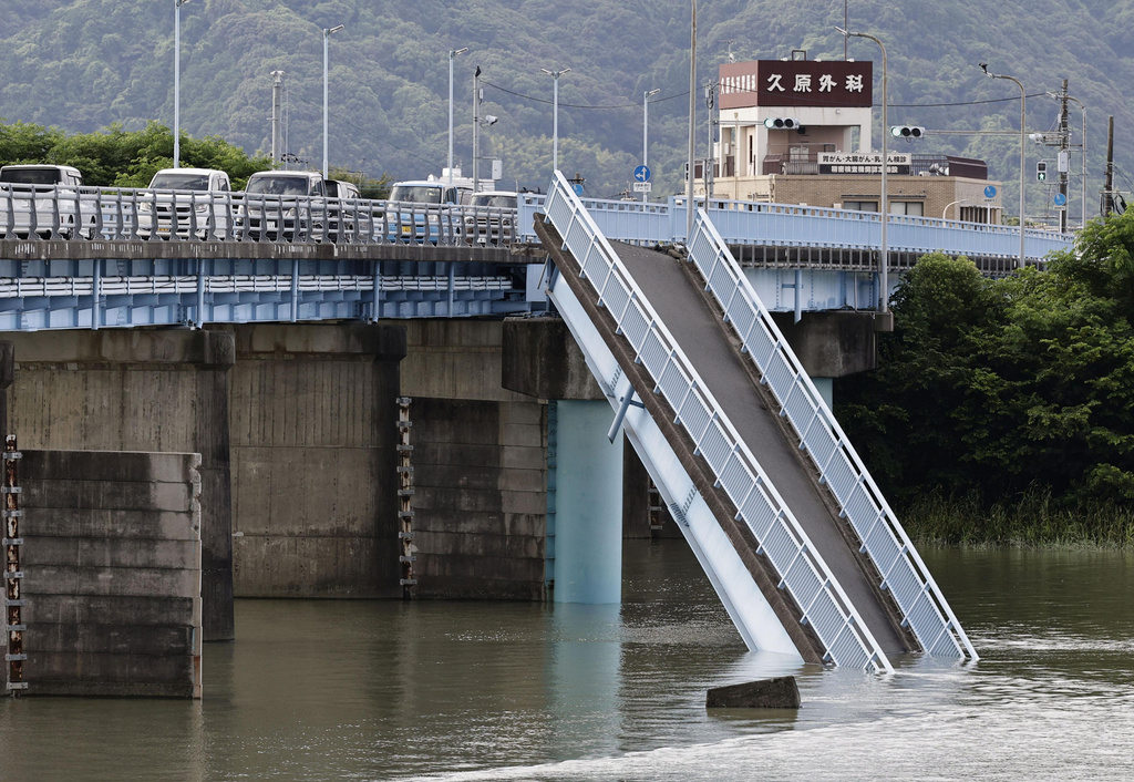 A collapsed bridge is seen following an earthquake in Yatsushiro, Kumamoto prefecture, Wednesday, July 29, 2026. (Juntaro Yokoyama/Kyodo News via AP)