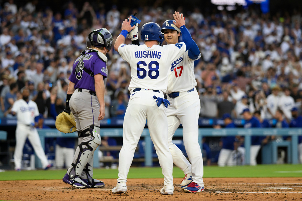 Los Angeles Dodgers' Shohei Ohtani (17) celebrates with Dalton Rushing (68) after hitting a two-run home run during the third inning of a baseball game against the Colorado Rockies in Los Angeles, Monday, July 6, 2026. (AP Photo/Kyusung Gong)