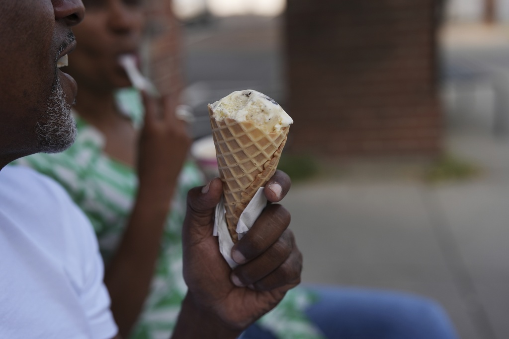 A person eats ice cream Friday, Sept. 5, 2025, in Cincinnati. (AP Photo/Joshua A. Bickel)