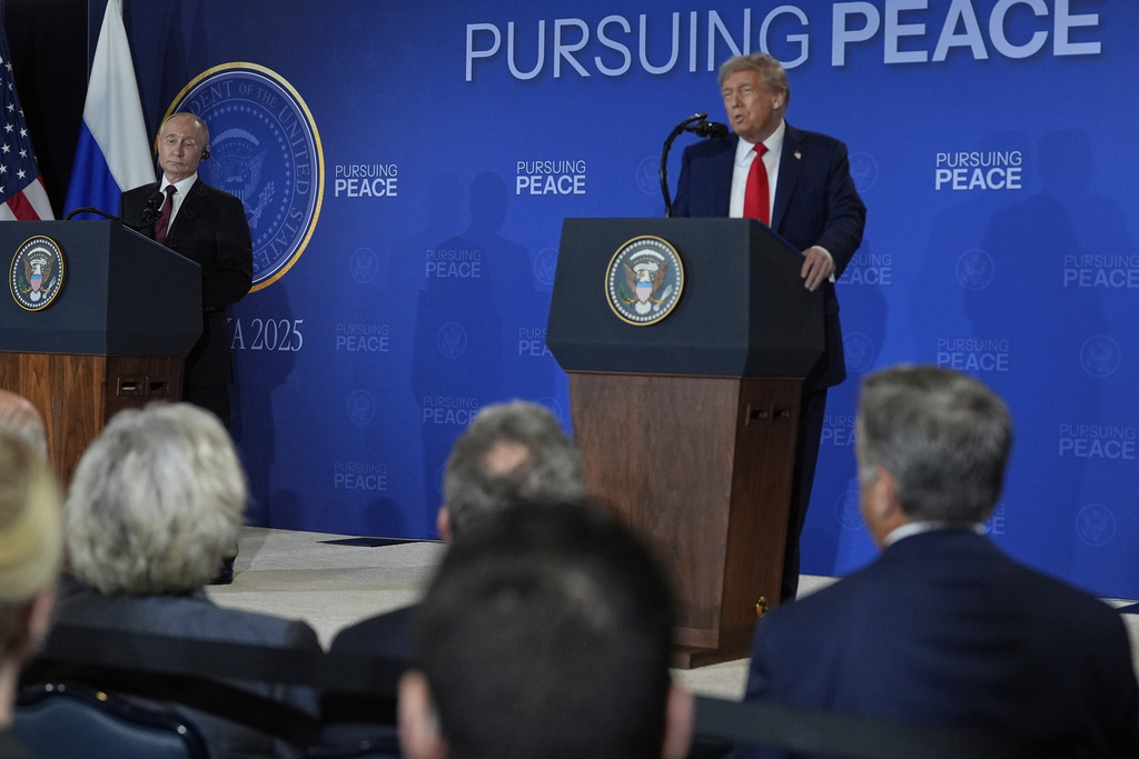 Russia's President Vladimir Putin listens as President Donald Trump speak during a news conference at Joint Base Elmendorf-Richardson, Alaska, Friday, Aug. 15, 2025. (AP Photo/Julia Demaree Nikhinson)