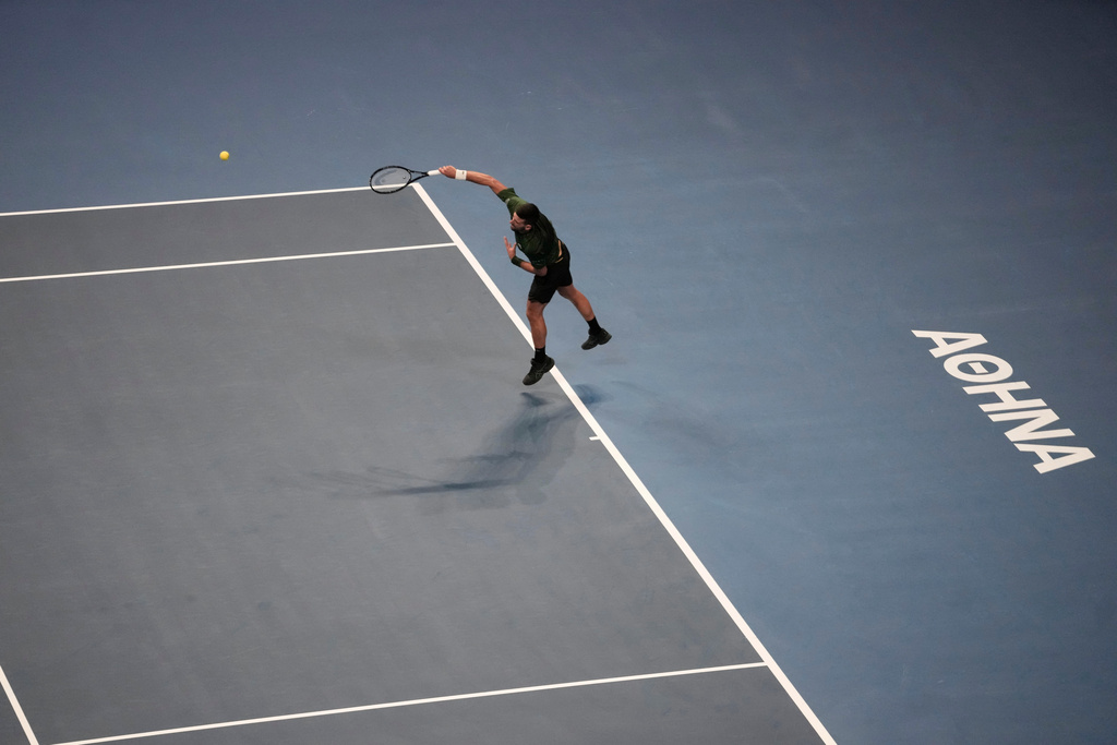 Novak Djokovic of Serbia plays a shot against Alejandro Tabilo of Chile during the ATP tournament round of 16 tennis match, in Athens, Greece, Tuesday, Nov. 4, 2025. (AP Photo/Petros Giannakouris)