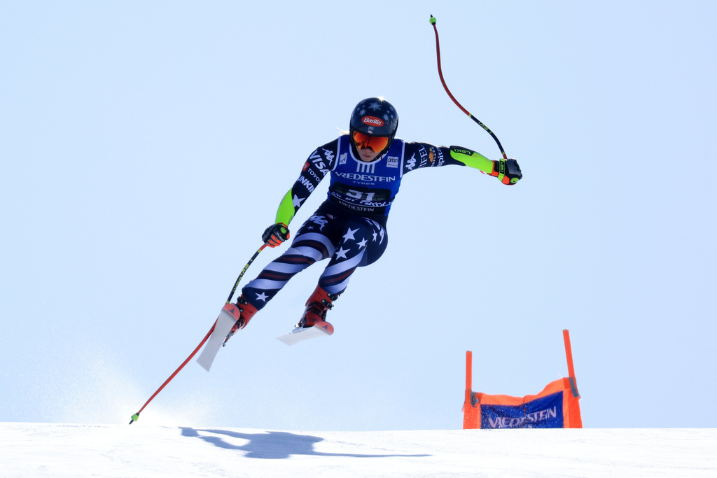 United States' Mikaela Shiffrin is airborne during an alpine ski, women's World Cup super-G, in Val di Fassa, Italy, Sunday, March 8, 2026. (AP Photo/Luciano Bisi)