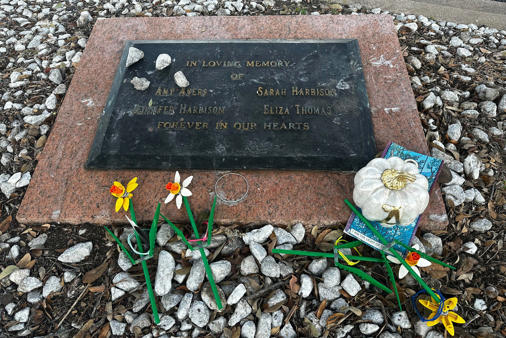 FILE - Tributes lay on a memorial Sept. 26, 2025, for four teenage girls who were killed in a yogurt shop in 1991 in Austin, Texas. (AP Photo/Paul J. Weber, File)