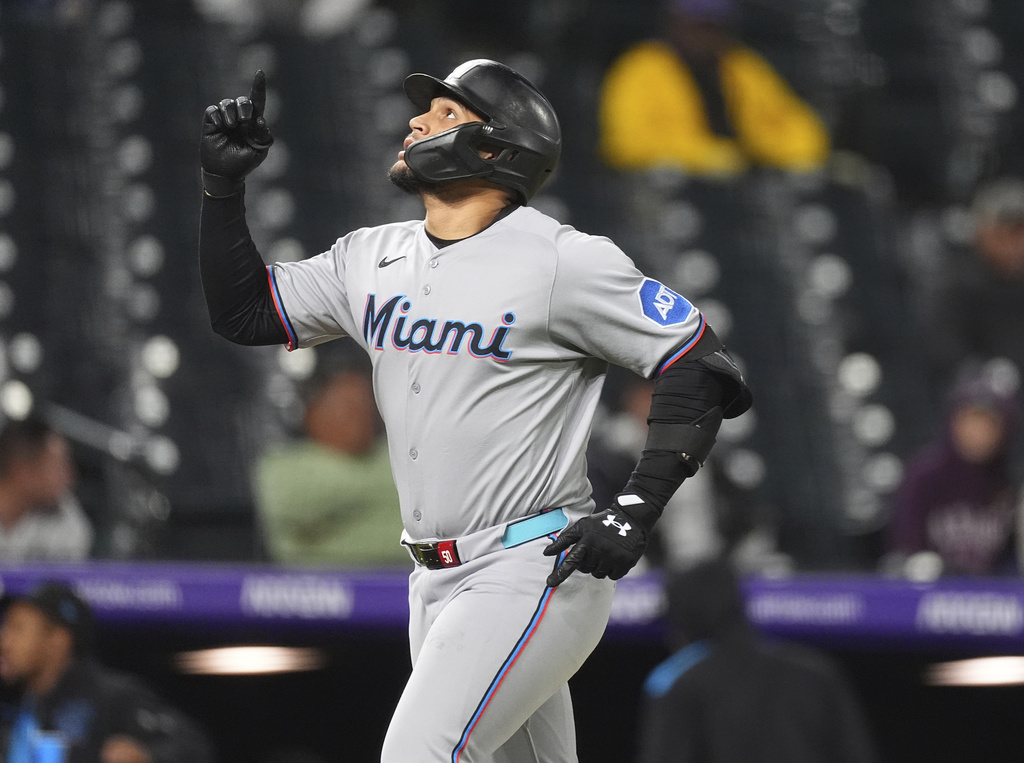 Miami Marlins' Agustín Ramírez gestures as he circles the bases after hitting a two-run home run off Colorado Rockies relief pitcher Roansy Contreras in the eighth inning of a baseball game Wednesday, Sept. 17, 2025, in Denver. (AP Photo/David Zalubowski)