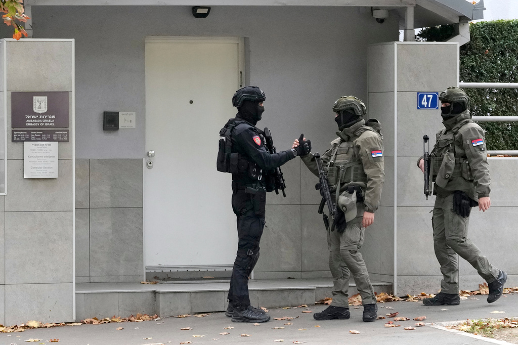 Serbian gendarmes guard the Israeli Embassy after an unidentified assailant attacked a guard with knives in Belgrade, Serbia, Wednesday, Oct. 28, 2026. (AP Photo/Darko Vojinovic)