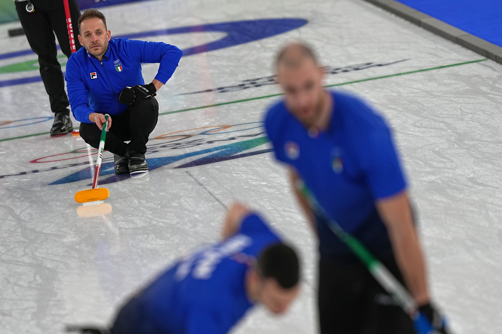 Italy's Joel Retornaz in action during the men's curling round robin session against Switzerland at the 2026 Winter Olympics, in Cortina d'Ampezzo, Italy, Thursday, Feb. 19, 2026. (AP Photo/Fatima Shbair)