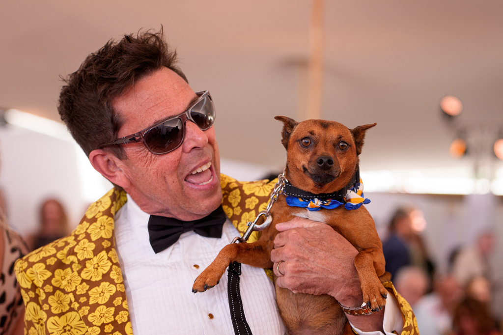 A person holds Tino, 5 years old, during the Palm Dog award ceremony at the 79th international film festival, Cannes, southern France, Friday, May 22, 2026. (AP Photo/Andreea Alexandru)