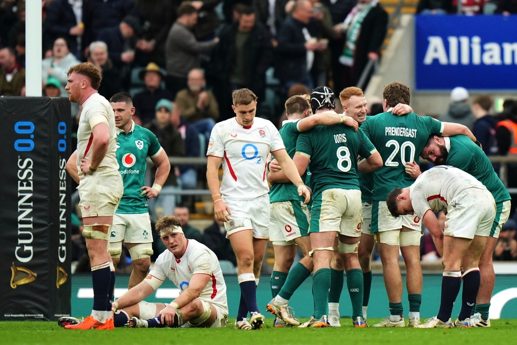Ireland's players celebrate following the Six Nations rugby union match between England and Ireland in London, England, Saturday, Feb. 21, 2026. (AP Photo/Alastair Grant)